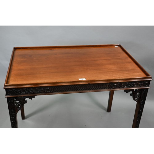 820 - An Edwardian Chippendale Revival walnut centre table, the top with all-round raised edge over a blin... 