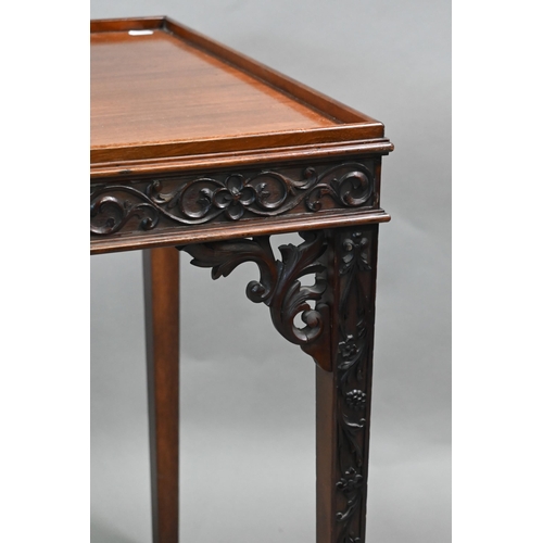 820 - An Edwardian Chippendale Revival walnut centre table, the top with all-round raised edge over a blin... 