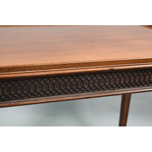 820 - An Edwardian Chippendale Revival walnut centre table, the top with all-round raised edge over a blin... 