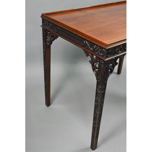 820 - An Edwardian Chippendale Revival walnut centre table, the top with all-round raised edge over a blin... 