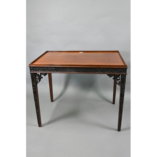 820 - An Edwardian Chippendale Revival walnut centre table, the top with all-round raised edge over a blin... 