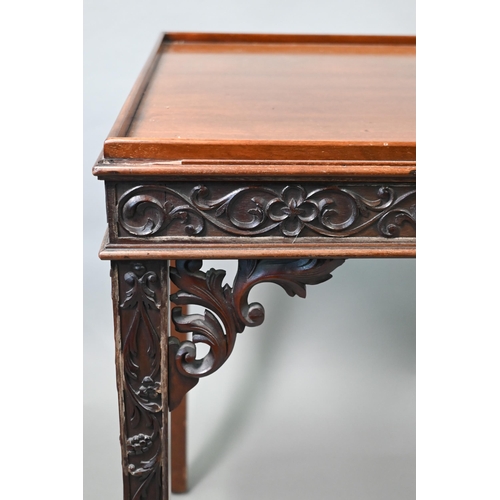 820 - An Edwardian Chippendale Revival walnut centre table, the top with all-round raised edge over a blin... 