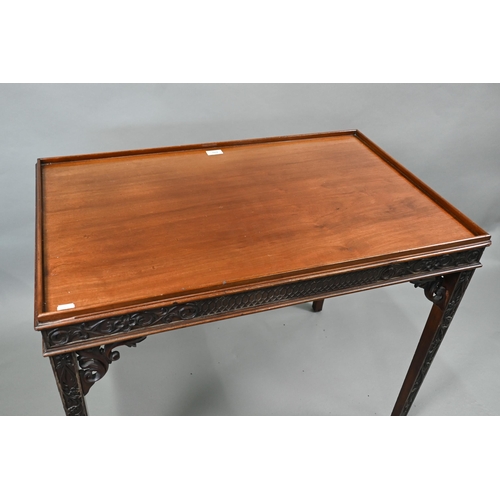 820 - An Edwardian Chippendale Revival walnut centre table, the top with all-round raised edge over a blin... 