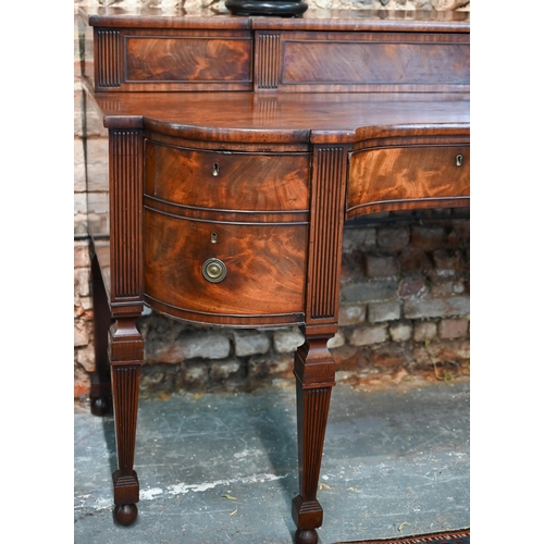 822 - A George III figured mahogany stage-back sideboard, the superstructure with two sliding door compart... 