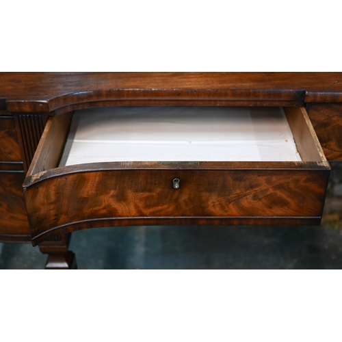 822 - A George III figured mahogany stage-back sideboard, the superstructure with two sliding door compart... 