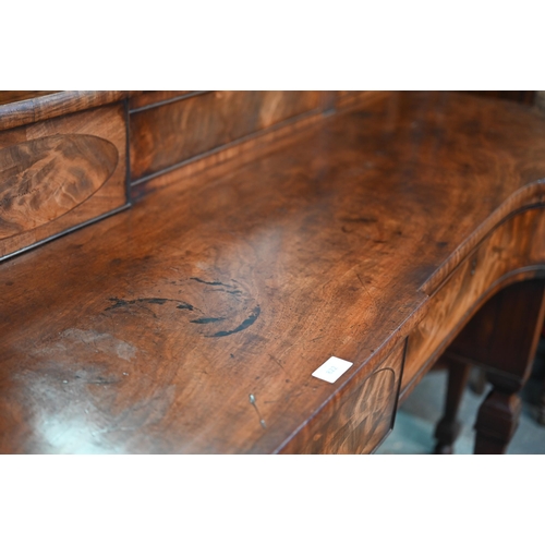 822 - A George III figured mahogany stage-back sideboard, the superstructure with two sliding door compart... 