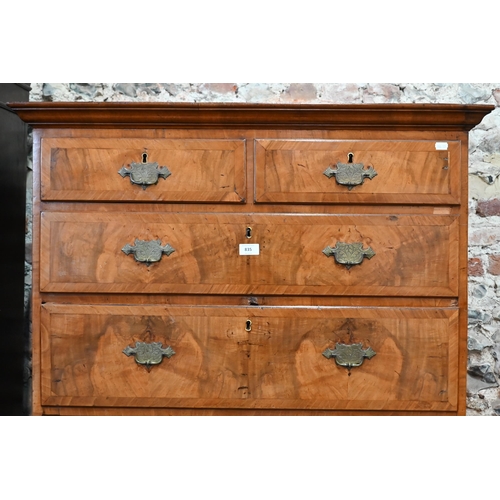 835 - An 18th century cross-banded walnut chest on chest, the moulded cornice over an arrangement of two s... 