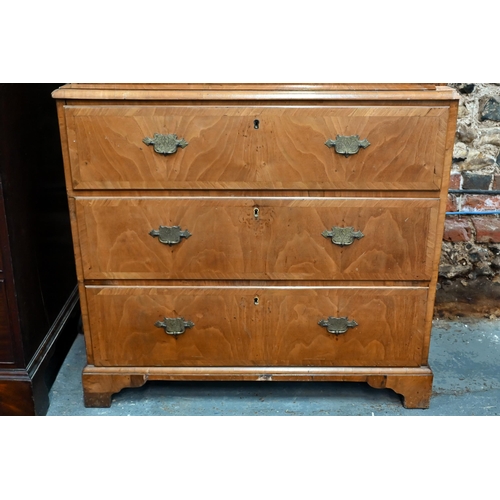 835 - An 18th century cross-banded walnut chest on chest, the moulded cornice over an arrangement of two s... 