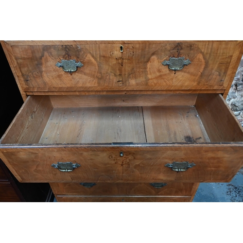 835 - An 18th century cross-banded walnut chest on chest, the moulded cornice over an arrangement of two s... 