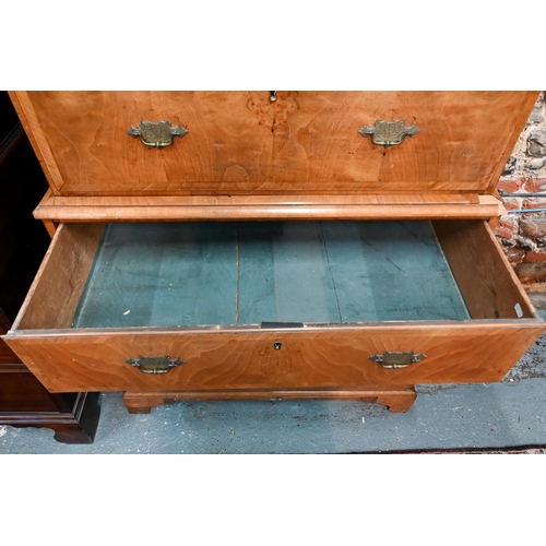 835 - An 18th century cross-banded walnut chest on chest, the moulded cornice over an arrangement of two s... 