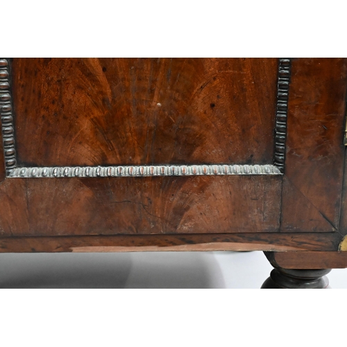 837 - A William IV brass bound figured mahogany two part campaign cabinet, the upper part having a pair of... 