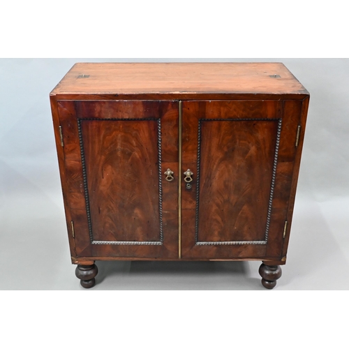 837 - A William IV brass bound figured mahogany two part campaign cabinet, the upper part having a pair of... 