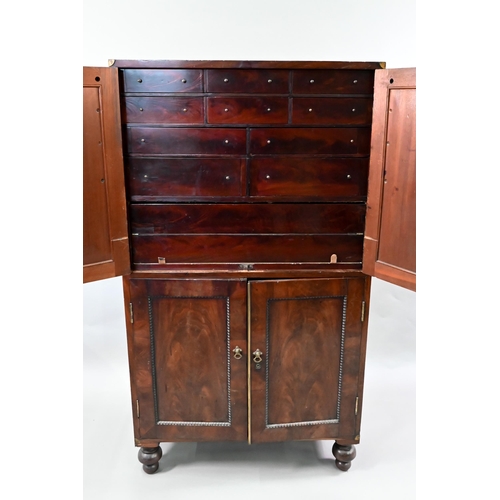 837 - A William IV brass bound figured mahogany two part campaign cabinet, the upper part having a pair of... 