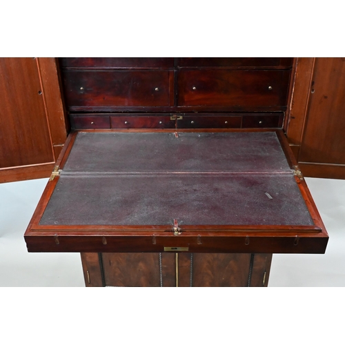 837 - A William IV brass bound figured mahogany two part campaign cabinet, the upper part having a pair of... 