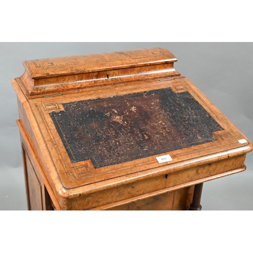 851 - A Victorian walnut Davenport desk, with hinged stage-back enclosing stationary compartments over a m... 