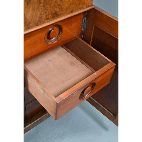 851 - A Victorian walnut Davenport desk, with hinged stage-back enclosing stationary compartments over a m... 