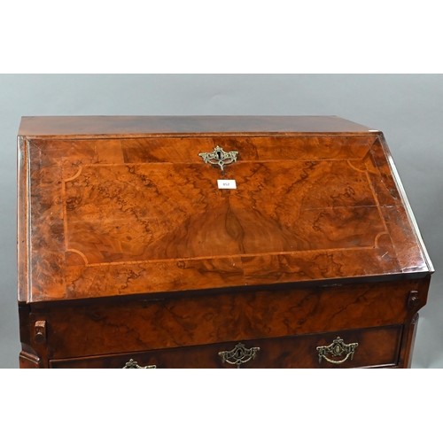 852 - An antique continental walnut 'bombe' bureau, the slope front with leather interior and enclosing a ... 