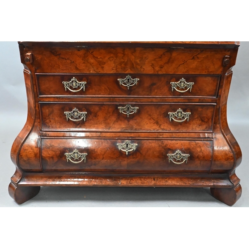 852 - An antique continental walnut 'bombe' bureau, the slope front with leather interior and enclosing a ... 