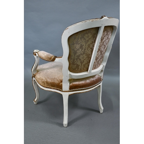 855 - A pair of antique French fauteuils with fabric panelled backs and overstuffed seats, raised on cabri... 