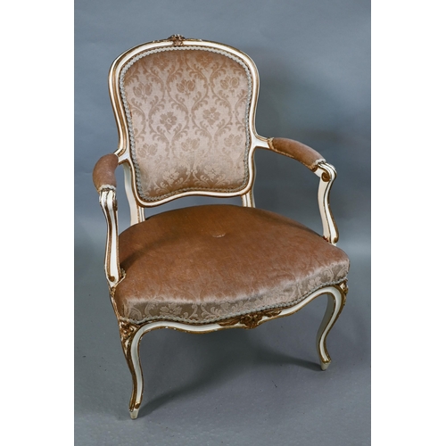 855 - A pair of antique French fauteuils with fabric panelled backs and overstuffed seats, raised on cabri... 