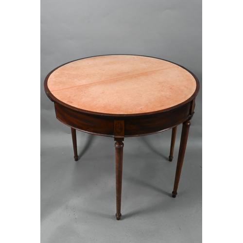 872 - A George III cross-banded radially veneered demi-lune card table, the fold over top with fabric inte... 