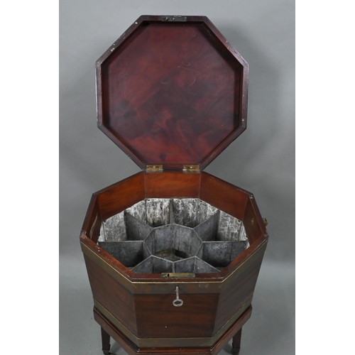 880 - A George III brass-bound mahogany cellarette, of octagonal form, raised on a conforming stand with s... 