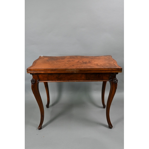 890 - A Victorian burr walnut card table, the serpentine fold over top raised on rose hip carved hip carve... 