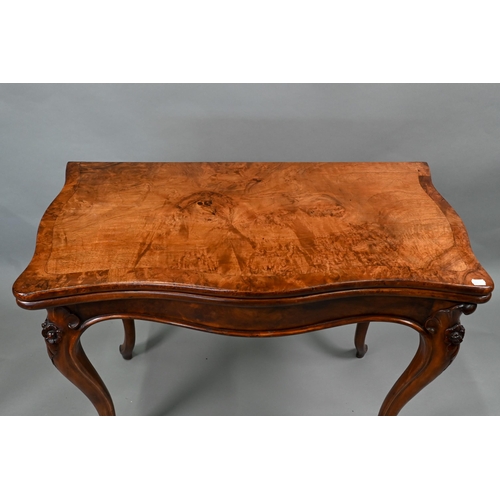 890 - A Victorian burr walnut card table, the serpentine fold over top raised on rose hip carved hip carve... 