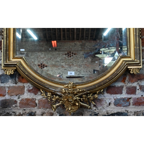 908 - A good 19th century giltwood framed mirror, surmounted by a flute playing cherub, in the baroque sty... 