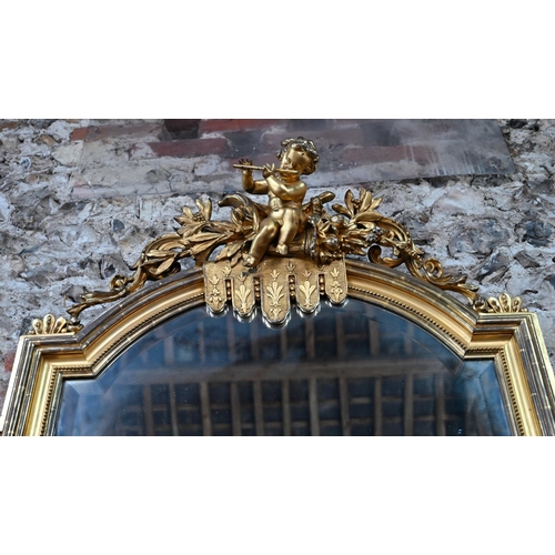 908 - A good 19th century giltwood framed mirror, surmounted by a flute playing cherub, in the baroque sty... 