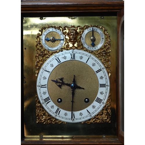 922 - An Edwardian oak bracket clock and bracket, the 8-day two train W & H Son movement striking the ... 