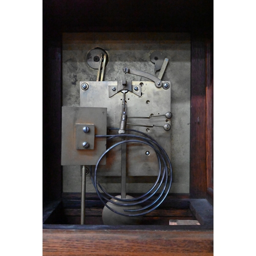 922 - An Edwardian oak bracket clock and bracket, the 8-day two train W & H Son movement striking the ... 