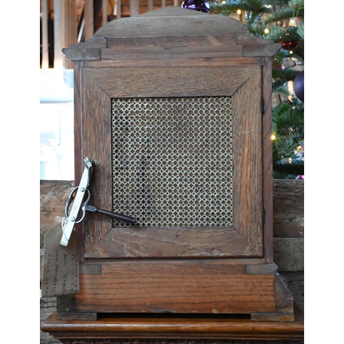 922 - An Edwardian oak bracket clock and bracket, the 8-day two train W & H Son movement striking the ... 