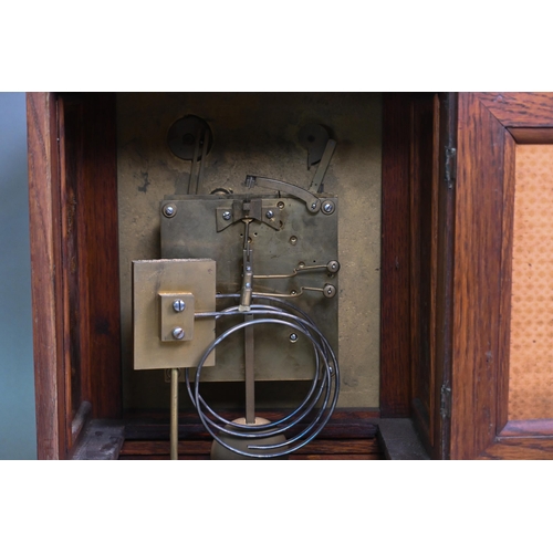 922 - An Edwardian oak bracket clock and bracket, the 8-day two train W & H Son movement striking the ... 