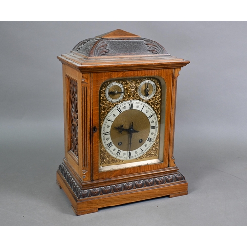 922 - An Edwardian oak bracket clock and bracket, the 8-day two train W & H Son movement striking the ... 