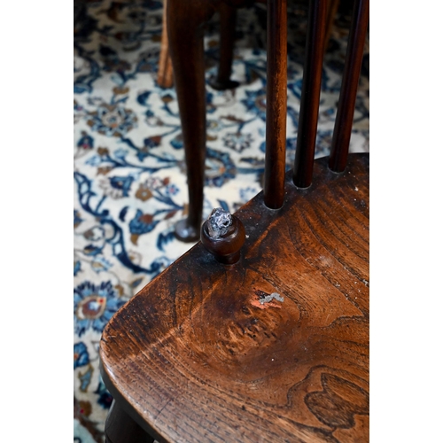 960 - A 19th century yew and elm Windsor hoop back elbow chair, raised on turned legs united by a crinolin... 