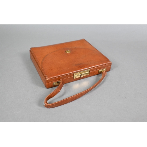 973 - A Davis of Piccadilly - a vintage tan leather vanity handbag, fully fitted with compartments includi... 