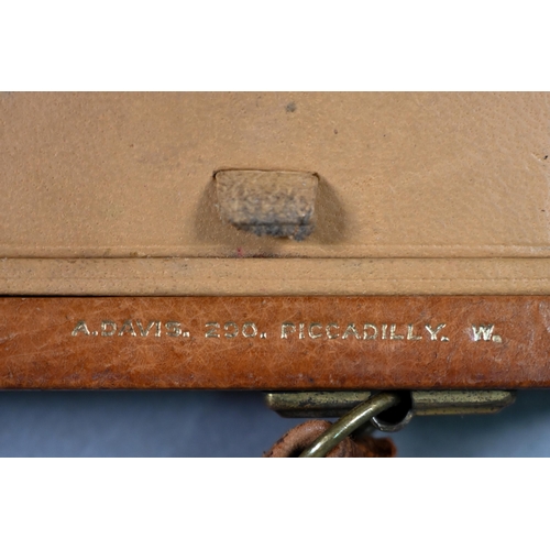 973 - A Davis of Piccadilly - a vintage tan leather vanity handbag, fully fitted with compartments includi... 