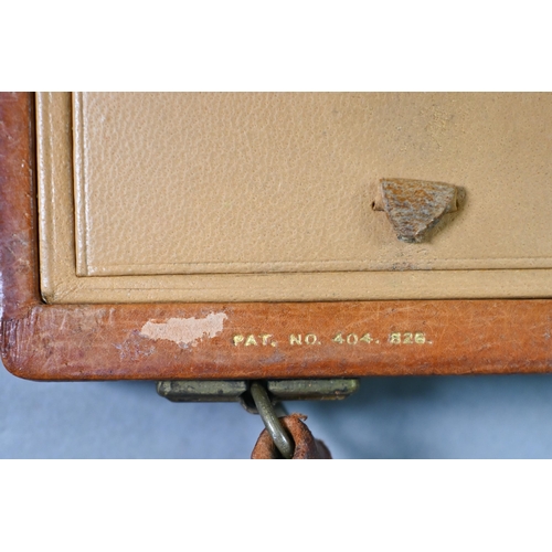 973 - A Davis of Piccadilly - a vintage tan leather vanity handbag, fully fitted with compartments includi... 