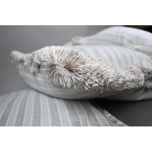 977 - Four feather-filled scatter cushions in pale blue and cream striped linen by Holland & Sherry wi... 