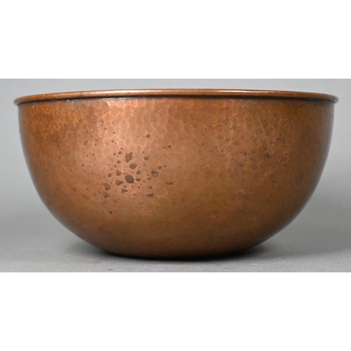 999 - A Newlyn hammered copper rose-bowl with pierced top, 20 cm diameter