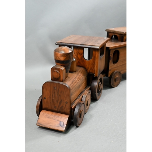 1096 - A large stained wood train set, comprising locomotive, tender, two carriages and an open wagon (poss... 