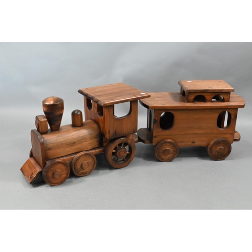 1096 - A large stained wood train set, comprising locomotive, tender, two carriages and an open wagon (poss... 