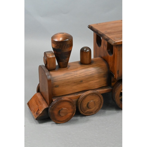 1096 - A large stained wood train set, comprising locomotive, tender, two carriages and an open wagon (poss... 