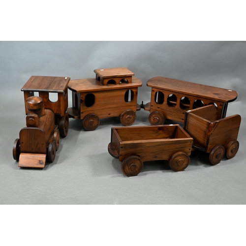 1096 - A large stained wood train set, comprising locomotive, tender, two carriages and an open wagon (poss... 