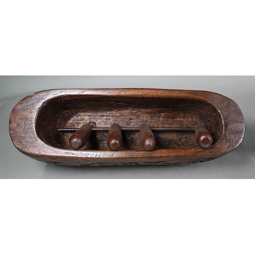 1117 - A Malayan carved wood zoomorphic stool with iron coconut-husker in it's 'mouth', 54 cm long oak, to/... 