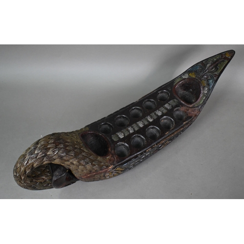 1117 - A Malayan carved wood zoomorphic stool with iron coconut-husker in it's 'mouth', 54 cm long oak, to/... 