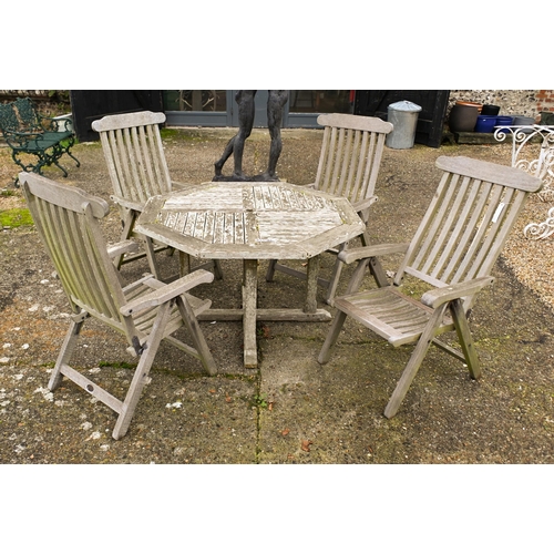 2 - A weathered Lister teak circular garden table, 165 cm dia. to/w a set of four Lister teak reclining ... 