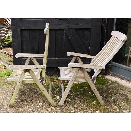 2 - A weathered Lister teak circular garden table, 165 cm dia. to/w a set of four Lister teak reclining ... 