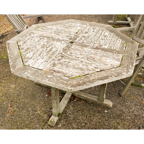 2 - A weathered Lister teak circular garden table, 165 cm dia. to/w a set of four Lister teak reclining ... 